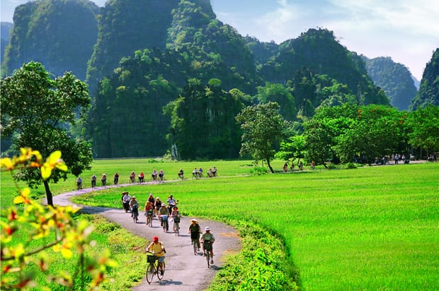 Cycling route through the Ninh Binh countryside near limestone mountains