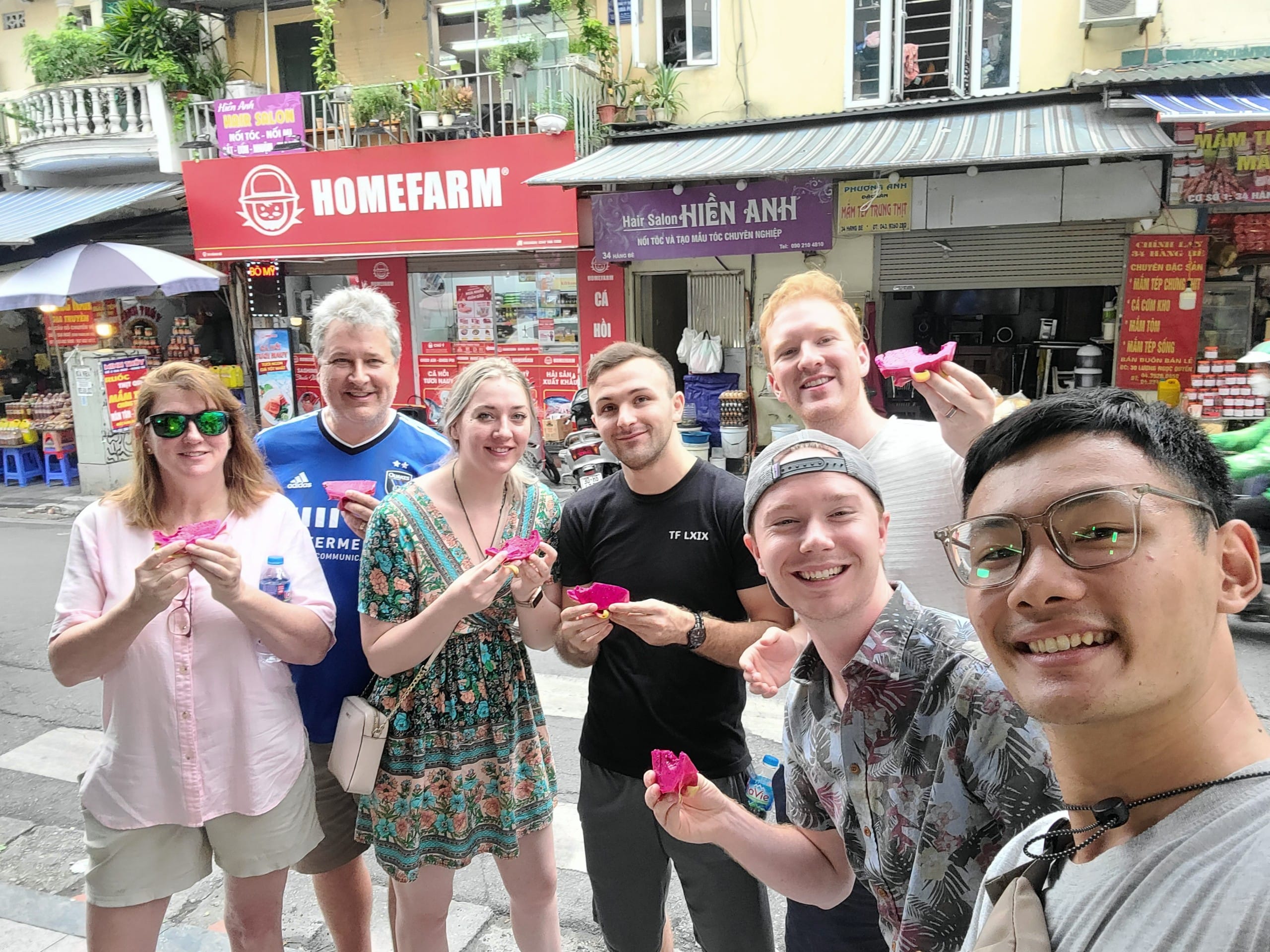 Local Hanoi guide helping travelers on a food tour
