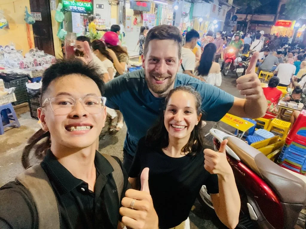 Couple enjoying a Hanoi street food tour together